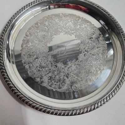 Sale Photo Thumbnail #266: DM71. Vintage Wm Rogers Silver-Plated Serving Tray

Description: Monogrammed with a J
Dimensions: 1x12x12
Damage: Normal wear