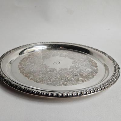 Sale Photo Thumbnail #265: DM71. Vintage Wm Rogers Silver-Plated Serving Tray

Description: Monogrammed with a J
Dimensions: 1x12x12
Damage: Normal wear
