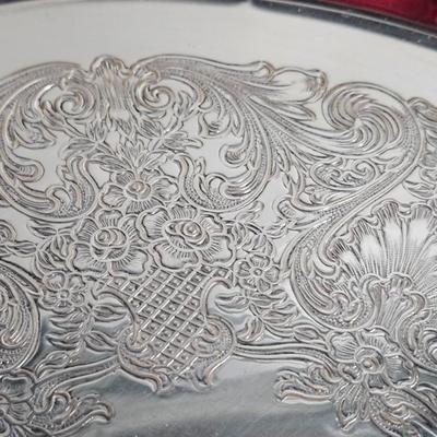 Sale Photo Thumbnail #270: DM71. Vintage Wm Rogers Silver-Plated Serving Tray

Description: Monogrammed with a J
Dimensions: 1x12x12
Damage: Normal wear