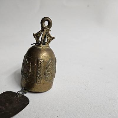 Sale Photo Thumbnail #304: DM80. Antique Asian Thai Brass Bell
Description: Possibly a temple bell
Dimensions: 7x1.5x1.5
Damage: Normal wear