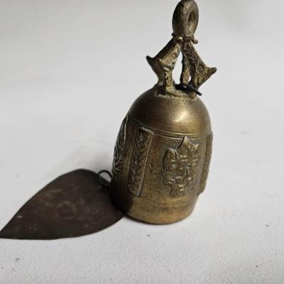 Sale Photo Thumbnail #305: DM80. Antique Asian Thai Brass Bell
Description: Possibly a temple bell
Dimensions: 7x1.5x1.5
Damage: Normal wear