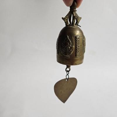 Sale Photo Thumbnail #303: DM80. Antique Asian Thai Brass Bell
Description: Possibly a temple bell
Dimensions: 7x1.5x1.5
Damage: Normal wear