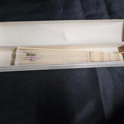 Sale Photo Thumbnail #331: Antique French Hand-Painted Transparent Hand Fan
Description: Floral and vine, in original box
Dimensions: Fan – 8x14, box – 1.5x10x1.5
Damage: Normal wear