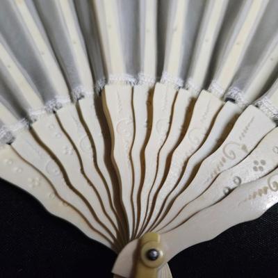 Sale Photo Thumbnail #328: Antique French Hand-Painted Transparent Hand Fan
Description: Floral and vine, in original box
Dimensions: Fan – 8x14, box – 1.5x10x1.5
Damage: Normal wear