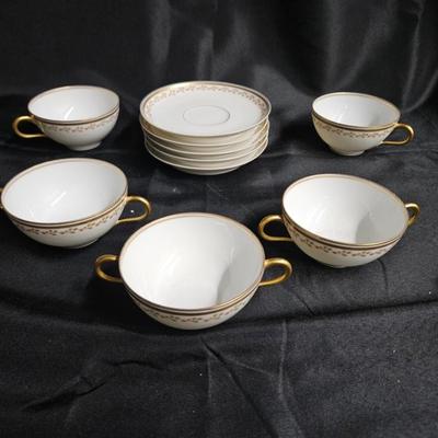 Sale Photo Thumbnail #375: Old Abby Limoges Porcelain Cups & Saucers
Description: 3 cream soup cups, 2 teacups, 5 saucers

Damage: Normal wear