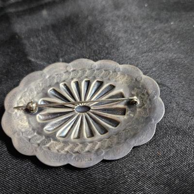 Sale Photo Thumbnail #403: Southwestern Oval Sterling Silver Pin 

Damage: Normal wear
