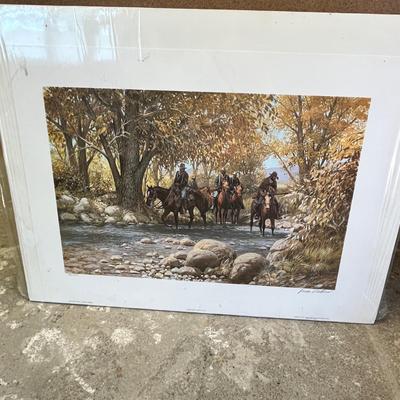Lot 340 Western print. Men on horseback walking down a river