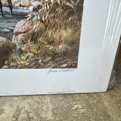 Lot 340 Western print. Men on horseback walking down a river