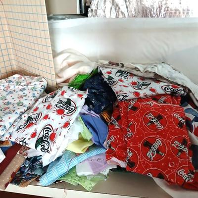 Large Lot of Assorted Cotton & Craft Fabrics – Novelty Prints, Yardage, Panels + Pattern Board in a storage tote
