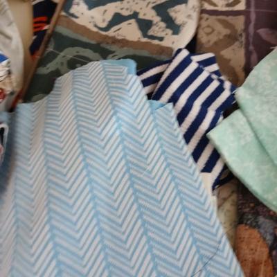 Large Lot of Assorted Cotton & Craft Fabrics – Novelty Prints, Yardage, Panels + Pattern Board in a storage tote