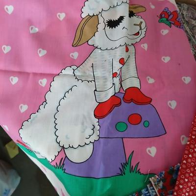 Large Lot of Assorted Cotton & Craft Fabrics – Novelty Prints, Yardage, Panels + Pattern Board in a storage tote