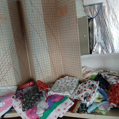 Large Lot of Assorted Cotton & Craft Fabrics – Novelty Prints, Yardage, Panels + Pattern Board in a storage tote