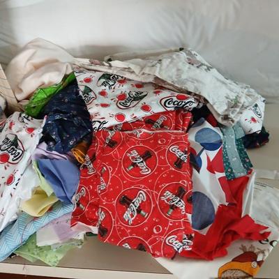 Large Lot of Assorted Cotton & Craft Fabrics – Novelty Prints, Yardage, Panels + Pattern Board in a storage tote