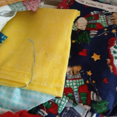 Large Lot of Assorted Cotton & Craft Fabrics – Novelty Prints, Yardage, Panels + Pattern Board in a storage tote