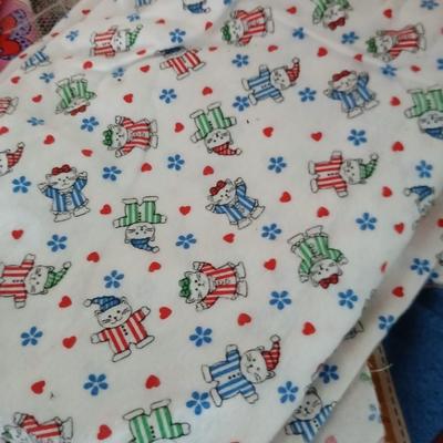 Large Lot of Assorted Cotton & Craft Fabrics – Novelty Prints, Yardage, Panels + Pattern Board in a storage tote