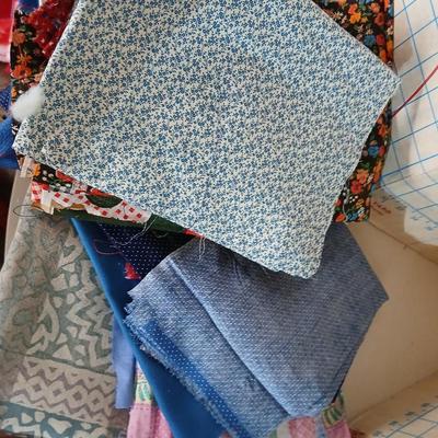 Large Lot of Assorted Cotton & Craft Fabrics – Novelty Prints, Yardage, Panels + Pattern Board in a storage tote