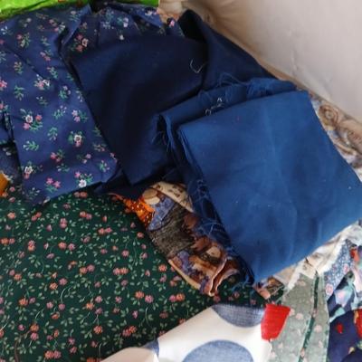 Large Lot of Assorted Cotton & Craft Fabrics – Novelty Prints, Yardage, Panels + Pattern Board in a storage tote