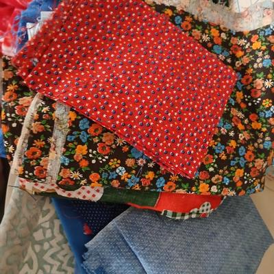 Large Lot of Assorted Cotton & Craft Fabrics – Novelty Prints, Yardage, Panels + Pattern Board in a storage tote