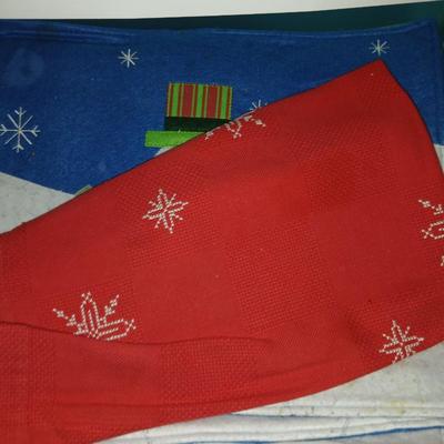A three-drawer Sterilite cart filled with a festive variety of seasonal table linens and fabric decor