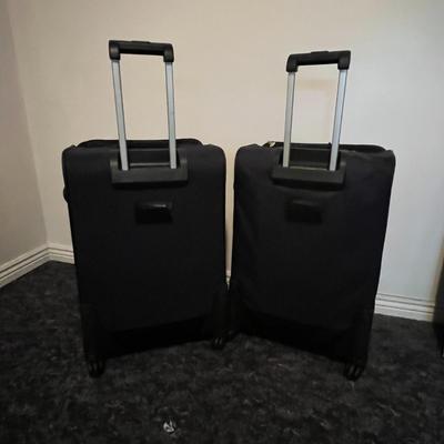 Set of Two Black Rolling Suitcases