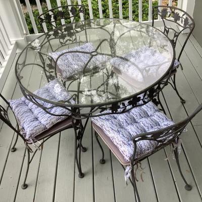 $349 glass top patio table and 4 chairs