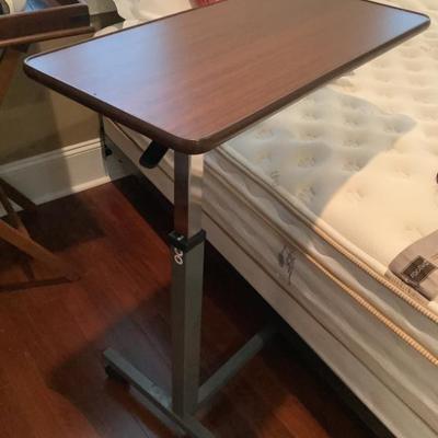 SOLD $18 metal adjustable tray stand on casters 