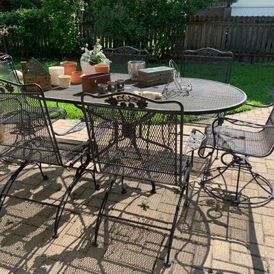 $795 patio table and 6 chairs all chairs are rockers, 2 are swivels - table measures 29”H 72”L 42”W