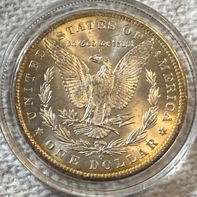 1885-O UNCIRCULATED CONDITION MORGAN SILVER DOLLAR AS PICTURED. (COIN #1742).
