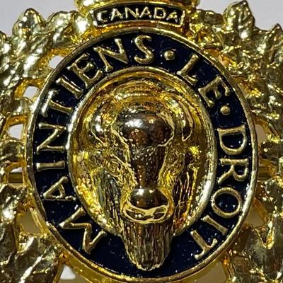 Scarce RCMP Royal Canadian Mounted Police Cap Badge -Gilt & Enameled in VG Preowned Condition.