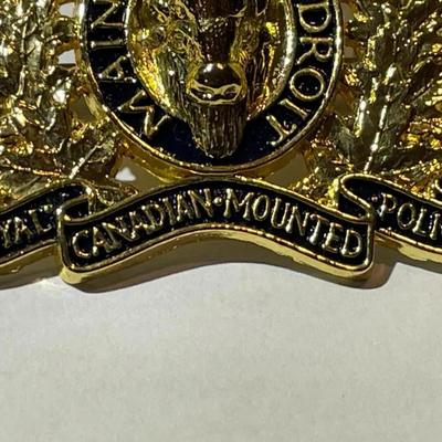 Scarce RCMP Royal Canadian Mounted Police Cap Badge -Gilt & Enameled in VG Preowned Condition.