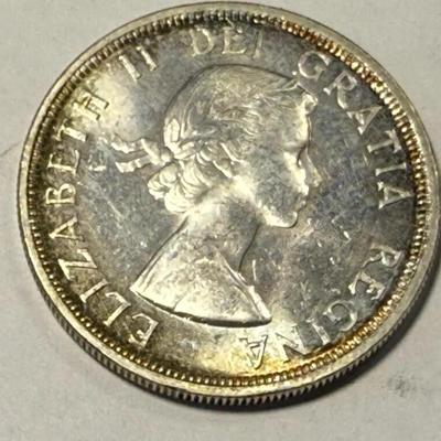 1953 Canada Silver Dollar with Shoulder Straps in Choice Brilliant Uncirculated as Pic'd.