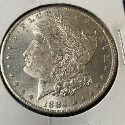 1884-O UNCIRCULATED CONDITION MORGAN SILVER DOLLAR (COIN #15).