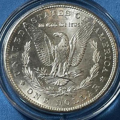 1879-S UNCIRCULATED CONDITION MORGAN SILVER DOLLAR AS PICTURED. (COIN #76A).