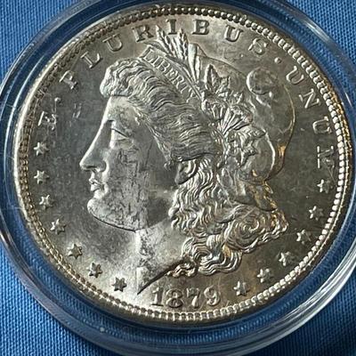 1879-S UNCIRCULATED CONDITION MORGAN SILVER DOLLAR AS PICTURED. (COIN #76A).