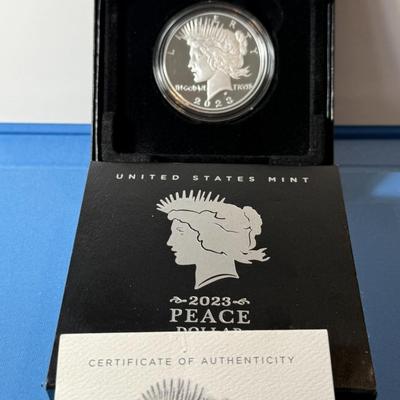 2023-S PROOF PEACE SILVER DOLLAR IN ORIGINAL BOX W/PAPERWORK AS PICTURED.