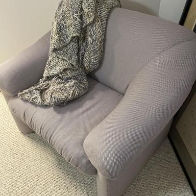 Modern style accent chair with soft afghan