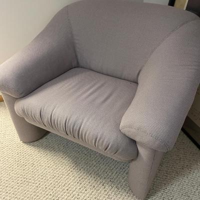 Modern style accent chair with soft afghan
