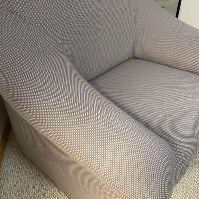 Modern style accent chair with soft afghan