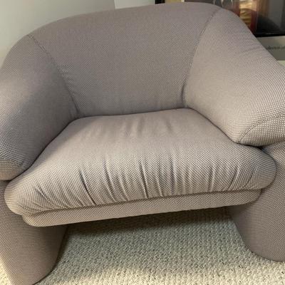 Modern style accent chair with soft afghan
