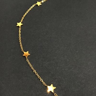 Marked dainty gold tone star chain necklace