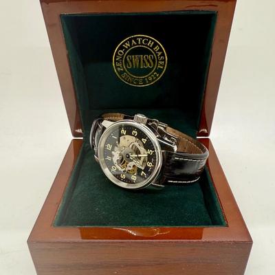 Sale Photo Thumbnail #11: Swiss made, stainless steel back.  Black leather band, luminous hands.  Manual winding, tested, runs as expected.  Good condition, includes wood and felt storage box.