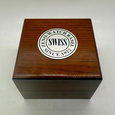 Sale Photo Thumbnail #13: Swiss made, stainless steel back.  Black leather band, luminous hands.  Manual winding, tested, runs as expected.  Good condition, includes wood and felt storage box.