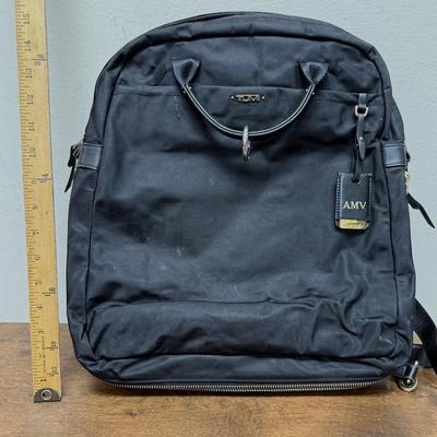 Sale Photo Thumbnail #530: Has backpack straps that can be tucked away, 2 luggage handles at the top. Designed to hold a 15" laptop and accessories.  Some scuff marks on the outside, but in overall good used condition. Approx. 15" x 15".
