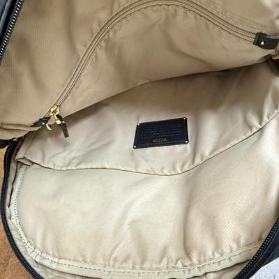 Sale Photo Thumbnail #527: Has backpack straps that can be tucked away, 2 luggage handles at the top. Designed to hold a 15" laptop and accessories.  Some scuff marks on the outside, but in overall good used condition. Approx. 15" x 15".