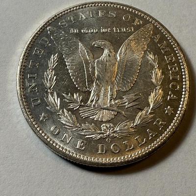 1904-O LAMINATION PEEL UNCIRCULATED CONDITION MORGAN SILVER DOLLAR AS PICTURED. (COIN #493).