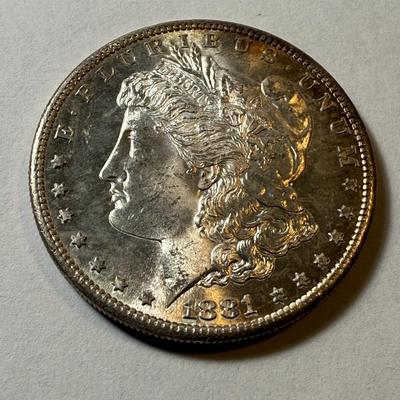 1881-S UNCIRCULATED CONDITION MORGAN SILVER DOLLAR AS PICTURED. (COIN #887).