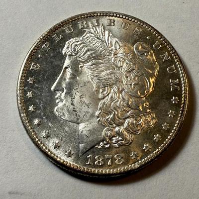 1878-S UNCIRCULATED CONDITION MORGAN SILVER DOLLAR AS PICTURED. (COIN #264).