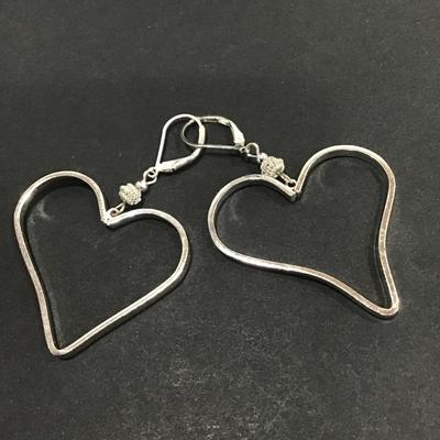 Silver toned heart dangle earrings
