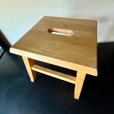 Sale Photo Thumbnail #581: Sturdy, solid wood step stool. Approx. 12" tall, top step measures approx. 12" x 12".  Great condition.