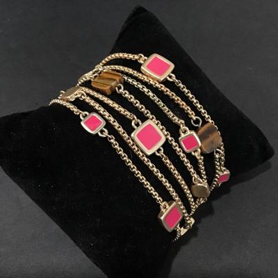 Satin gold, toned, pink and tigers eye. Magnetic clasp bracelet. Very nice.